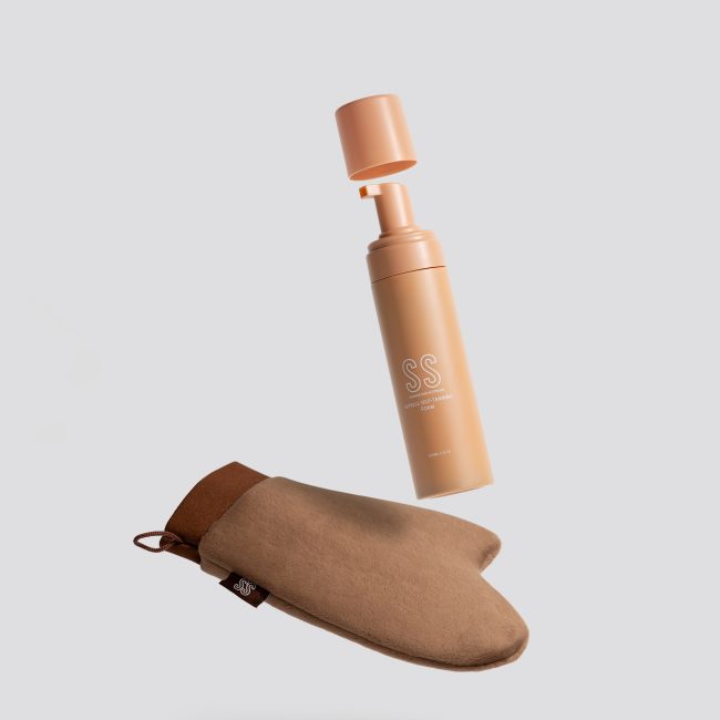 Summer Skin cosmetic bottle floating above a suede pouch in a minimal skincare product photography setup.