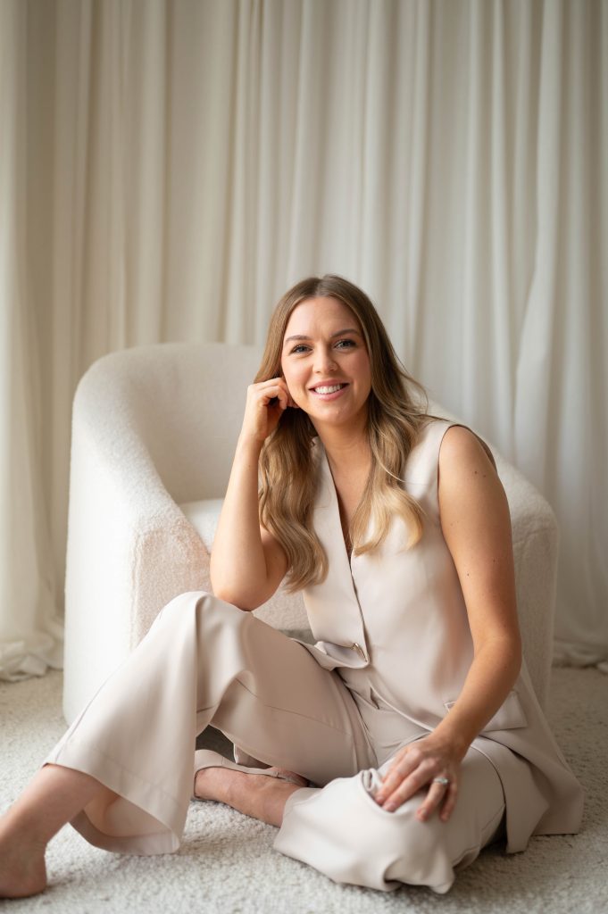 Woman in a cream satin outfit smiling during a personal brand photography session in the Adelaide Hills