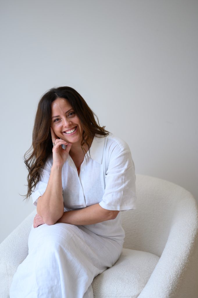 Woman in white linen smiling during a personal branding photo session in Adelaide