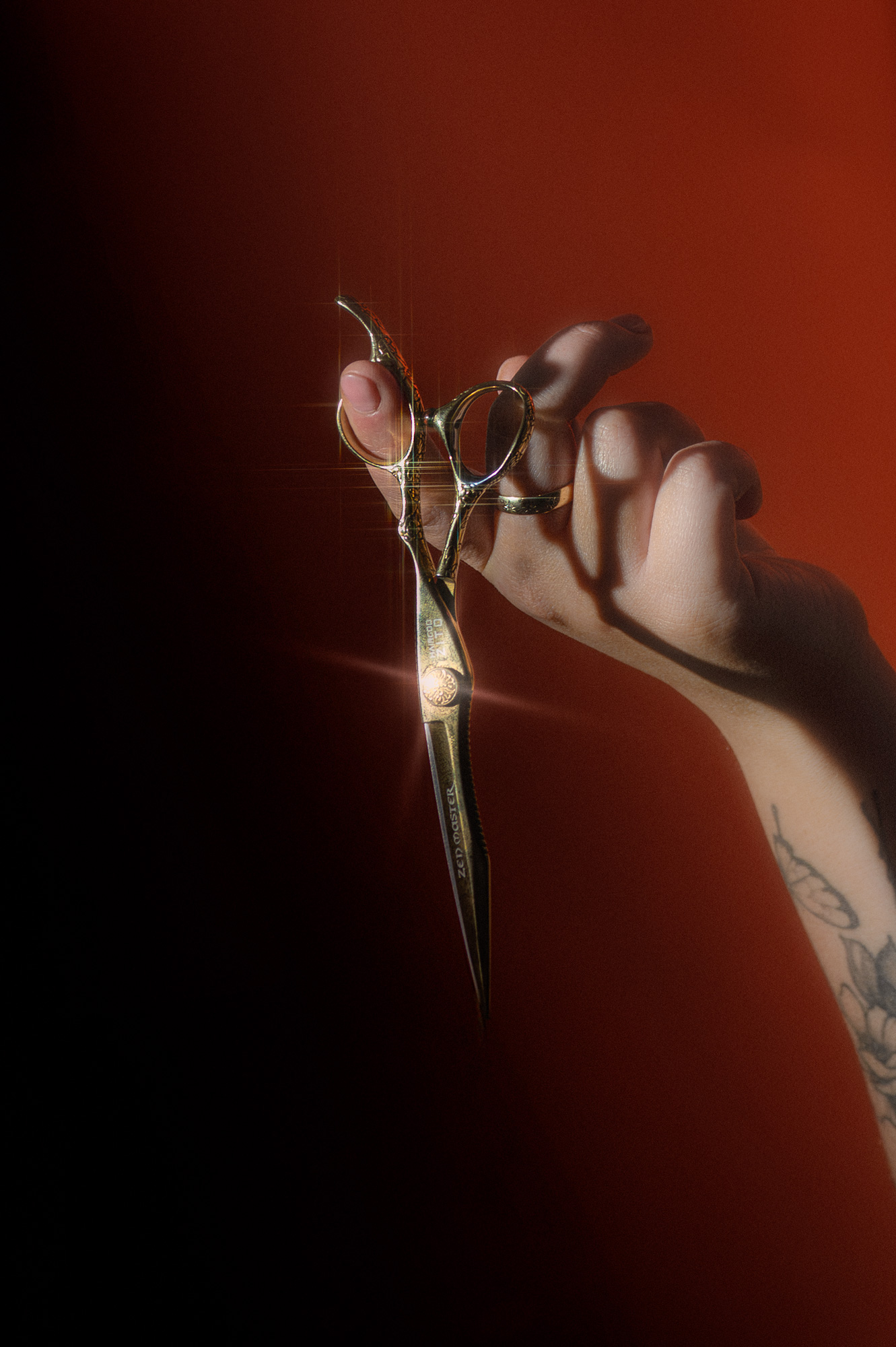 gold-hairdresser-scissors-hanging-on-finger